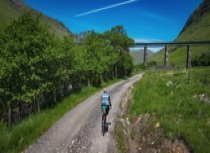 Cyclist approaches the West Highland viaduct  - part of the West Coast Cycle Trail